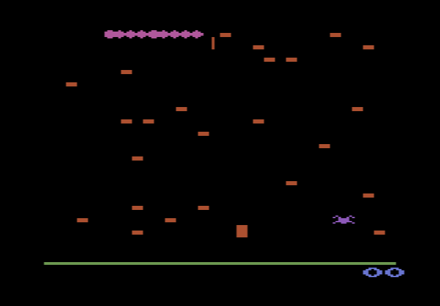 Atari 2600 Centipede: the segmented centipede winding down through a field of mushrooms towards the player's shooter