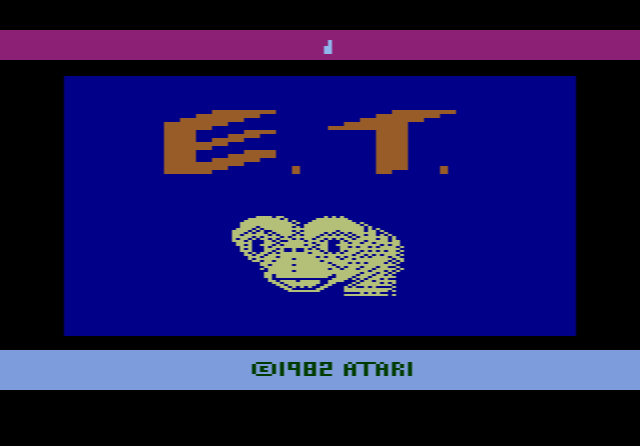 E.T. the Extra-Terrestrial on the Atari 2600: E.T. standing on a green field dotted with pits, with the power zone icon at the top of the screen