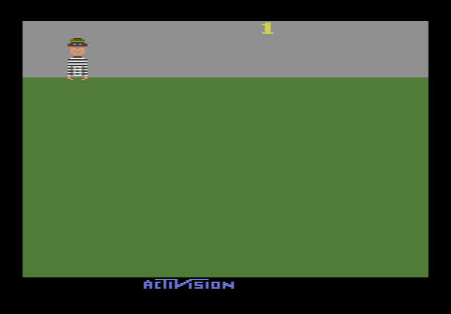 Kaboom!: the Mad Bomber dropping bombs from the top of the screen onto a stack of three water buckets