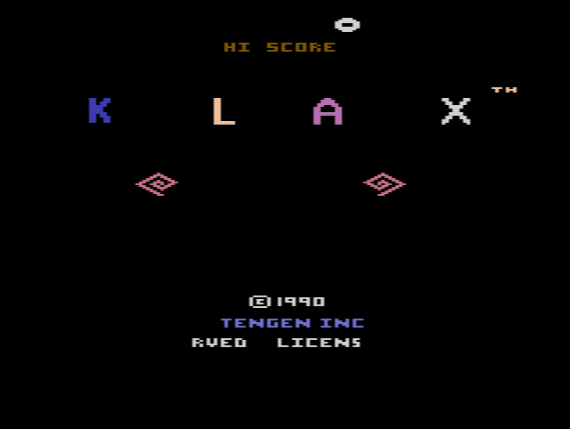 Klax: coloured tiles tumbling down a conveyor belt towards the paddle and the bin below