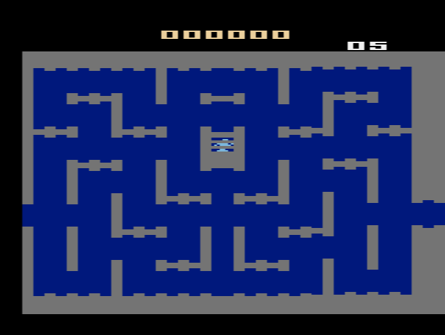 The PAL Night Stalker screen with the score and counters above the maze