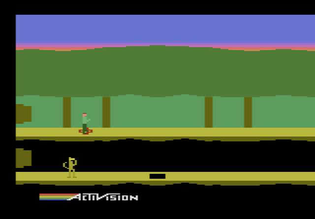 Pitfall II: Lost Caverns: Pitfall Harry in the jungle under a pink evening sky
