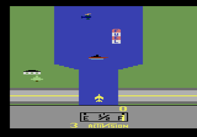 A jet flying up a narrow river past helicopters and a fuel depot in River Raid